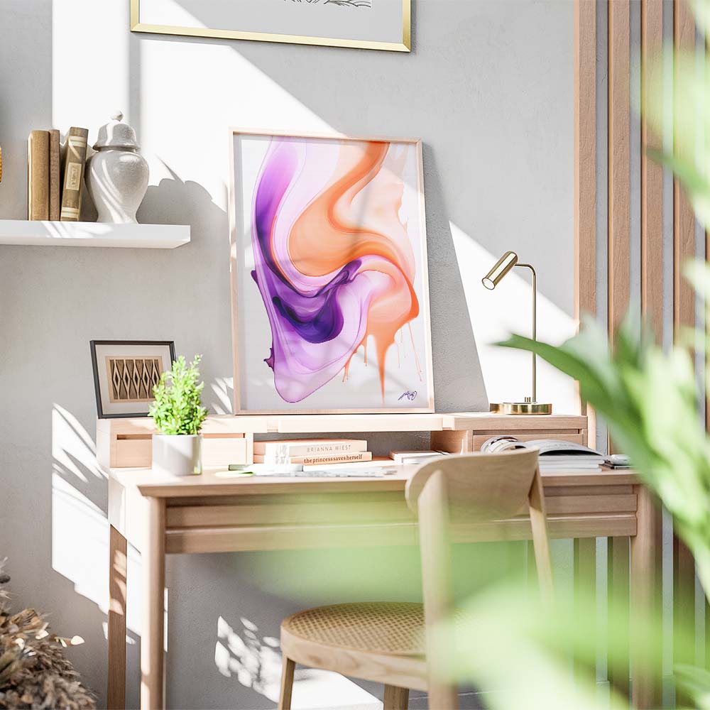 An orange and purple abstract painting on a white wall above a wooden sideboard with a lamp, a plant, and a candle.